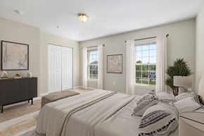Martinsburg townhouse for rent - A bedroom with a large bed and a dresser.